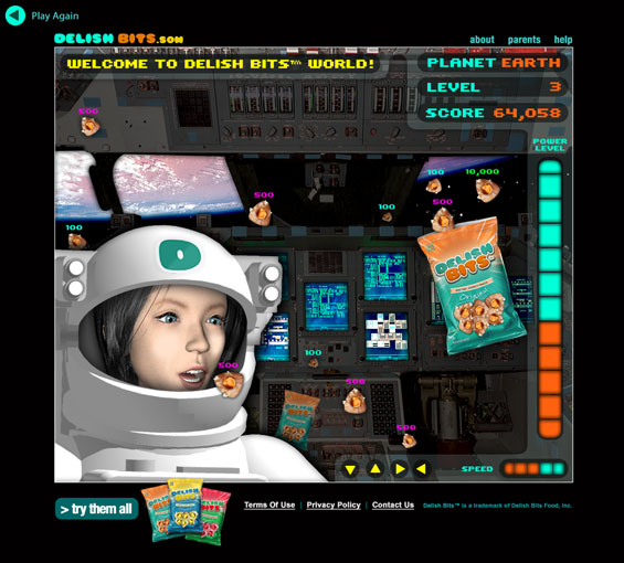 Image of a computer screen displaying a scene from a space-themed game that features Delish Bits snacks.