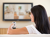 Photo of woman watching TV