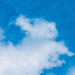 a white cloud in a blue sky